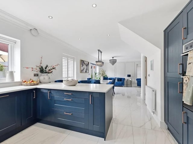 The stunning open-plan dining kitchen perfectly balances luxury styling with everyday practicality