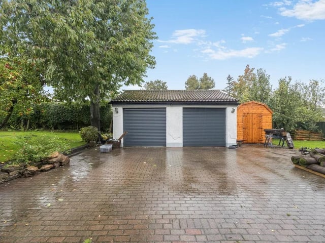 The property boasts a double garage and spacious driveway,  ideal for off road parking.
