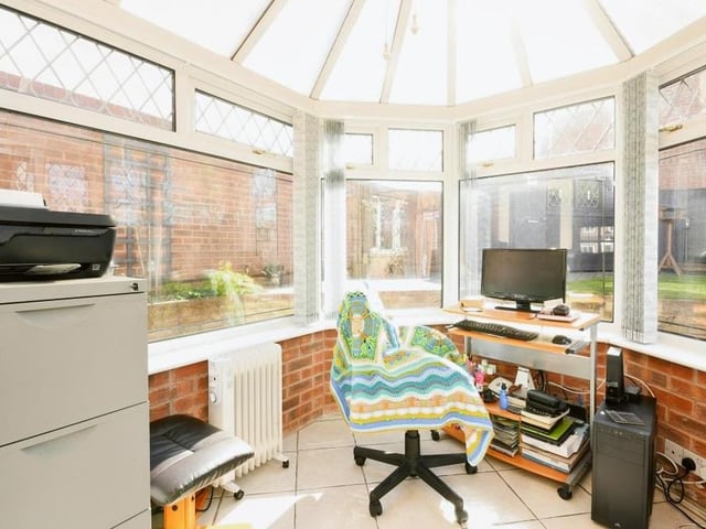 Here is that conservatory we were talking about. It's extremely bright and can even be converted into an office if required.