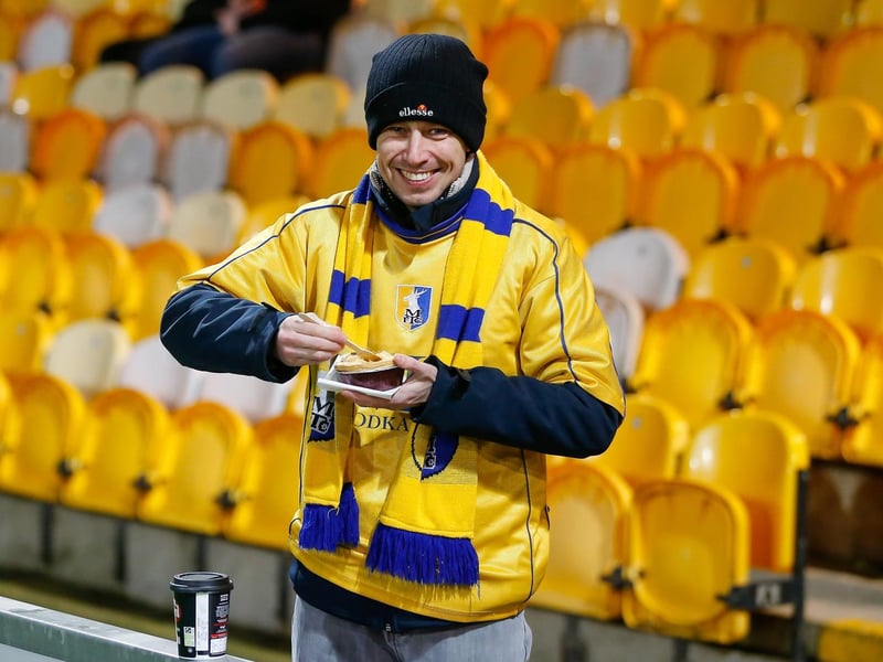 Mansfield Town's faces in the crowd against Swindon Town.