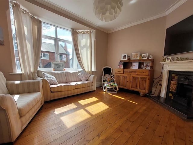 There are two lounges on the ground floor of the Mansfield property. Here is the first, with its feature fireplace and cosy demeanour.