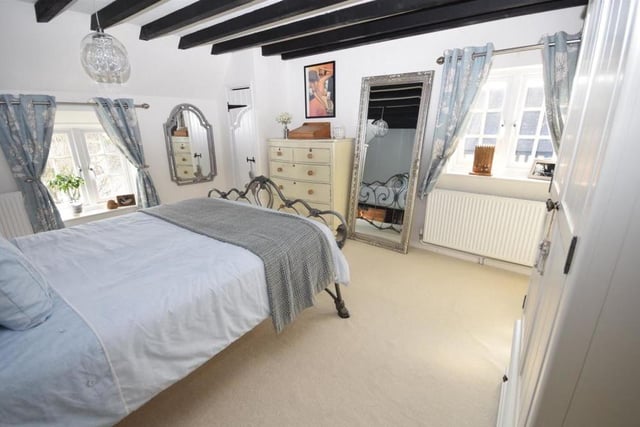 The principal bedroom on the first floor is a substantial size, and oozes charm, helped, of course, by the beamed ceiling. Windows at the front and side of the cottage allow lots of natural light to flow.