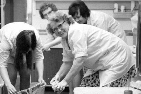 The ladies manage a smile whilst wringing out their cloths after the floods of '73.