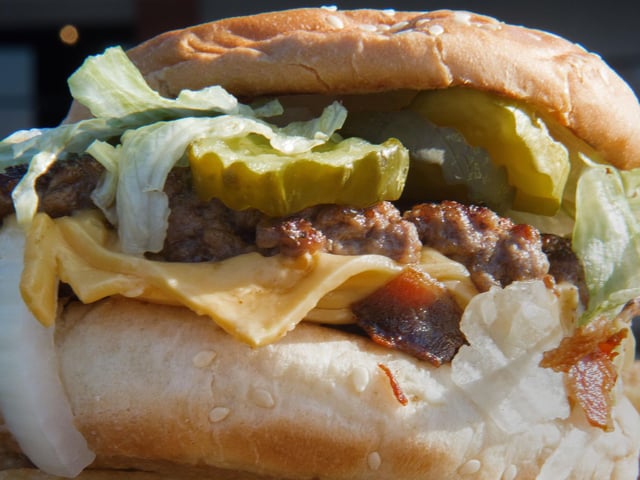 Bacon Cheeseburger from Five Guys is the most popular dish ordered on Deliveroo (Photo by PAUL J. RICHARDS/AFP via Getty Images)