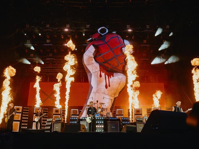 Green Day kicked off their debut headline slot with American Idiot