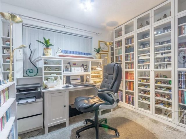 Another use has also been found for this bedroom -- and it seems to be thriving in its role as a busy office!