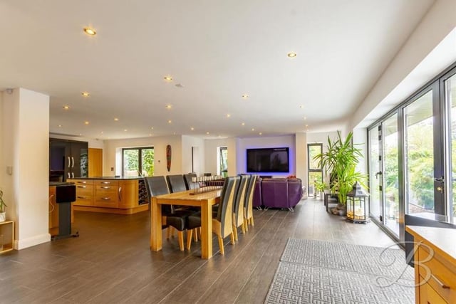 With the kitchen and living area in the background, here is the dining room. The floor is tiled and the bi-folding doors lead to the back of the £500,000 property.
