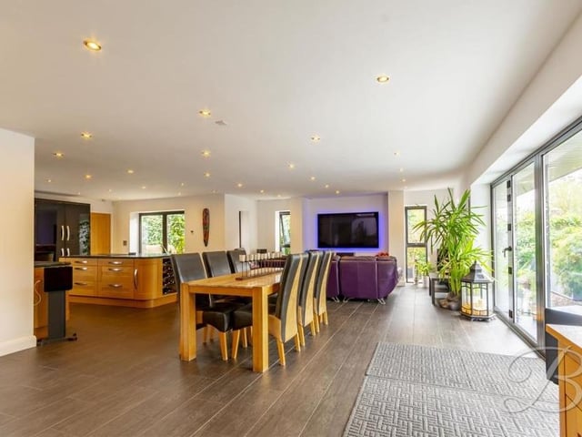 With the kitchen and living area in the background, here is the dining room. The floor is tiled and the bi-folding doors lead to the back of the £500,000 property.