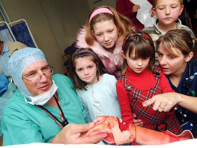 Consultant orthopaedic surgeon John Hambridge and A&E sister Ruth Marshall showed some young visitors a mock up of casualty patients care. 2007.