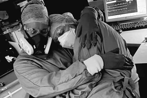 This photograph of Karen Colbeck-Rowe (left) and Jill Kirk has gone viral, showing the emotion of working on CCU.