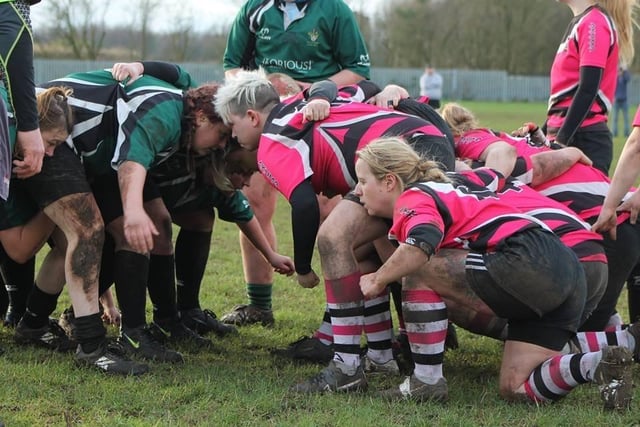 The Ashfield Ladies side form up for a scrum during a match.