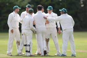Hosiery Mills' bowler Daniel Harris is congratulated after taking two wickets in two balls in defeat at Papplewick on Saturday.