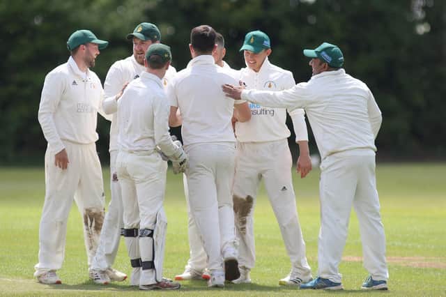 Hosiery Mills' bowler Daniel Harris is congratulated after taking two wickets in two balls in defeat at Papplewick on Saturday.