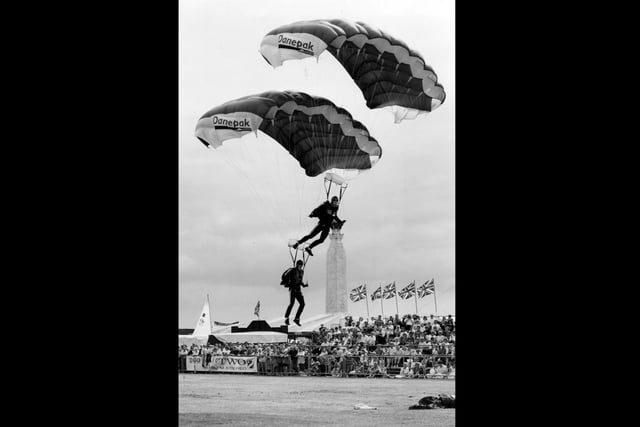 A twin landing by two of the FLying Dragons freefall parachute display team, at the Southsea Show, 1993. The News PP5207