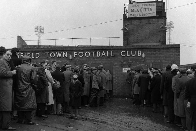 Considered the oldest functioning stadium of England's professional league system and one of the oldest football grounds in the world, Mansfield's Field Mill's name is owed to a large mill which used to stand just south of the field until its demolition in 1925. It has hosted football since 1861, although some reports date it back as far as 1850. Field Mill was renamed One Call Stadium in 2013. Image: 1962 sees these big queues gather outside Field Mill.