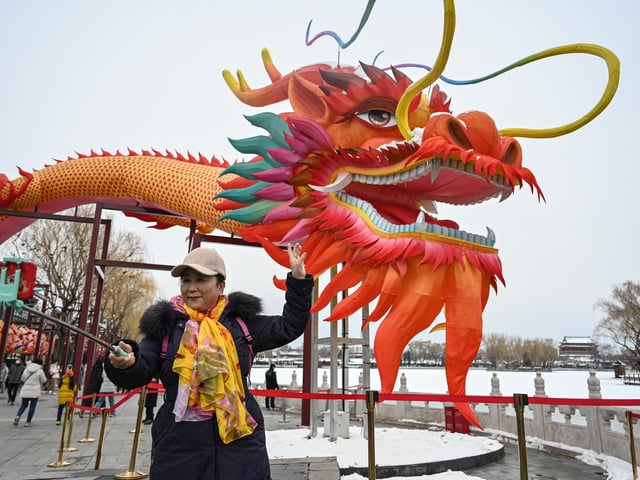 While our modern Gregorian calendar adds only one leap day on February 29 nearly every four years, the Chinese add a whole leap month approximately every three years. Approximately every three years (7 times in 19 years), a leap month is added to the Chinese calendar. The Chinese calendar uses a solar term system that has 12 principal terms to indicate when the Sun's longitudes is a multiple of 30 degrees. Unlike all other months, the leap month does not contain a principal term. Information provided by www.timeanddate.com (Photo: A woman takes a selfie next to a dragon installation after snowfall in Beijing on February 21, 2024).