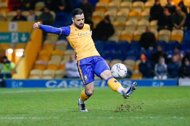 Mansfield Town defender Stephen McLaughlin in action against Swindon Town. Photo credit - Chris Holloway / The Bigger Picture.media