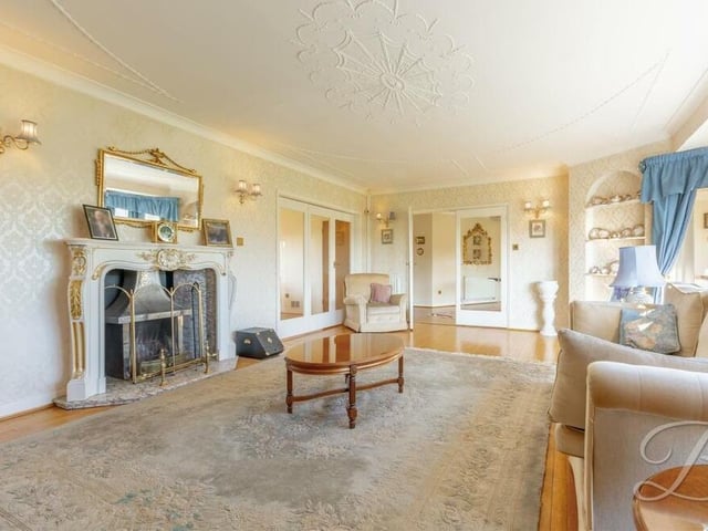 This second shot of the lounge shows its impressive feature fireplace.