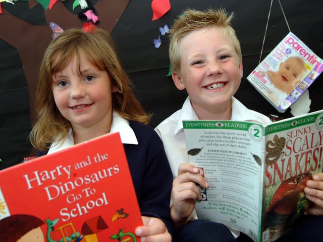 Rachel and Ryan Mellins, aged six and eight at the time, who took part in the Big Wild Read summer reading project at Edwinstowe Library where they were presented with certificates and medals after completing six books. Year: 2007
