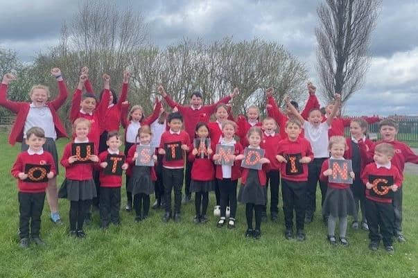 Jubilant children at Crescent Primary School in Mansfield celebrate the 'Outstanding' verdict from Ofsted