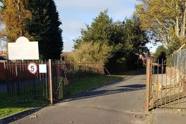 The gates at the Clipstone Parish Cemetery which thieves broke through to steal a drive on  mower and equipment stored in a container on the cemetery car park.