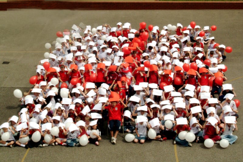 Pupils of Jefferies Primary School Kirkby showed their support to the England football team by making the shape of the St George's flag, 2006.