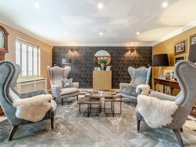 Just off the reception hall is this lovely, cosy seating area. Beautifully appointed, it features a tiled floor, ceiling spotlights and coving to the ceiling.