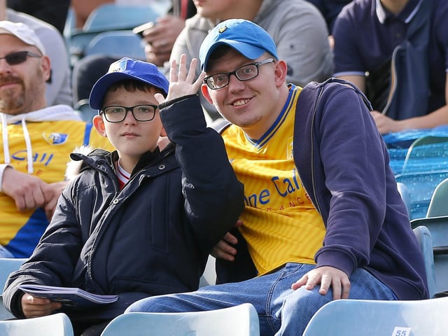 Mansfield Town fans watch the 1-1 draw at Gillingham.