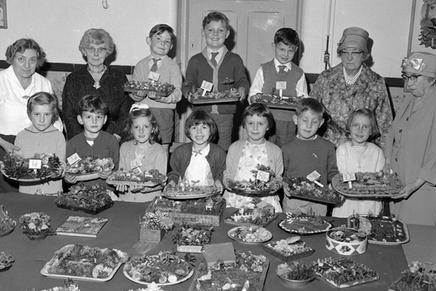 Kids from Warsop show off plates of goodies at the school back in 1962.