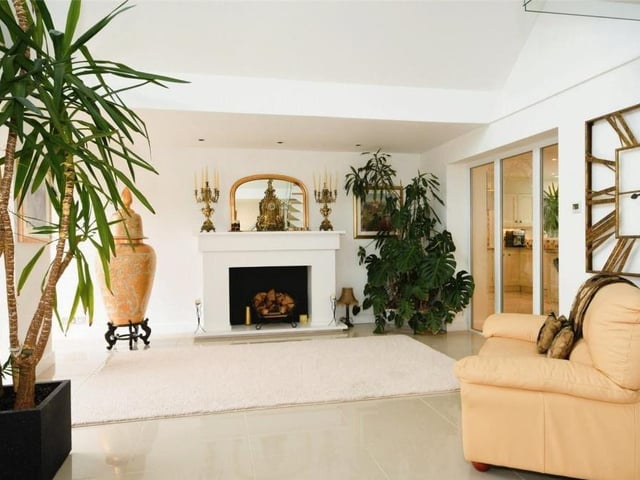 Adding even more character to the reception hall is this exquisite fireplace with surround, offering a warm welcome to all.