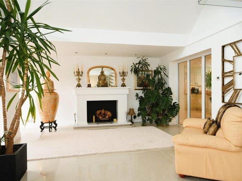 Adding even more character to the reception hall is this exquisite fireplace with surround, offering a warm welcome to all.