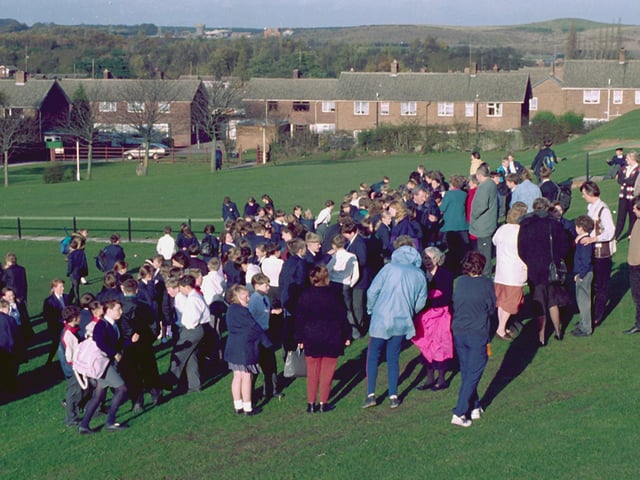 Students evacuate Joseph Whitaker School after a fire.
