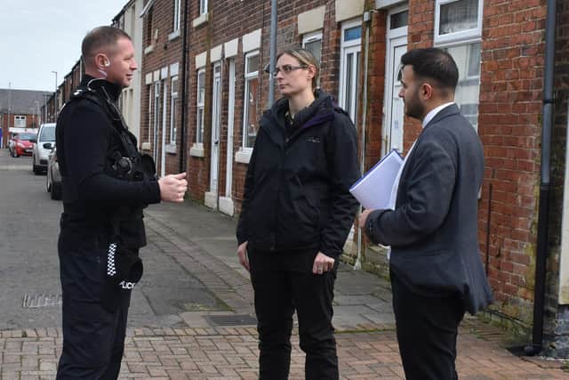 Inspector Mark Dickson, Coun Helen-Ann Smith and Antonio Taylor, community safety manager