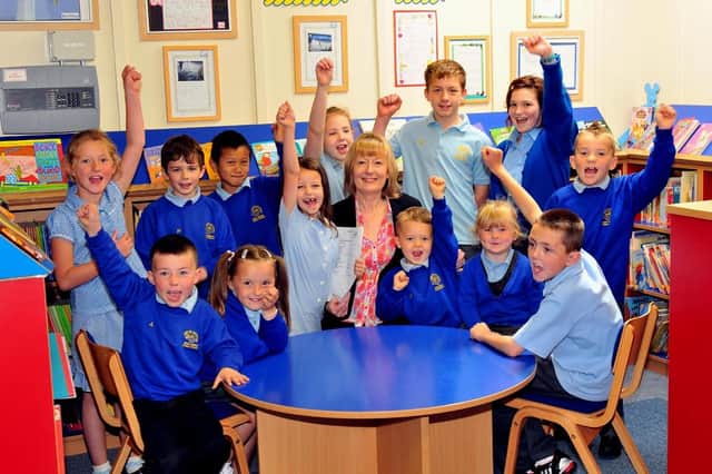 Ward Jackson primary school headteacher Jan Brough with pupils Ruby Crossling, Owen Chapman, Ebony Lee, Jonathan Little, Euan Devonshire, Liam Nichols, Kevin Zhang, Kira Foster, Siobhain Horton, Luke Oates, Joseph Hall, Chelsey Jukes and Caitlin Rutherford, as they celebrate their Ofsted report. Does this bring back happy memories from nine years ago?