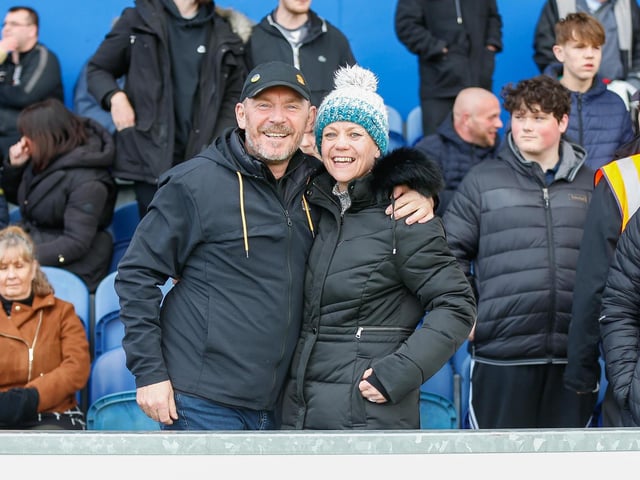 Mansfield Town fans watch the match against Northampton Town.