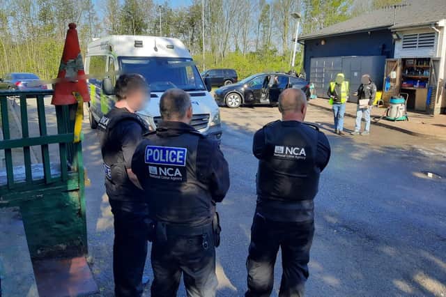 NCA officers and Nottinghamshire Police officers raided a car wash business in Nuthall. Photo: NCA
