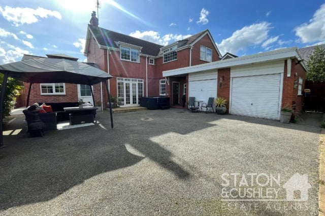 As well as the garage at the front, a double garage can be found at the back of the house, where there is also a pleasant patio. The current owner has plans to convert the double garage into a new kitchen/living space, which would add even more stardust to the ground floor.