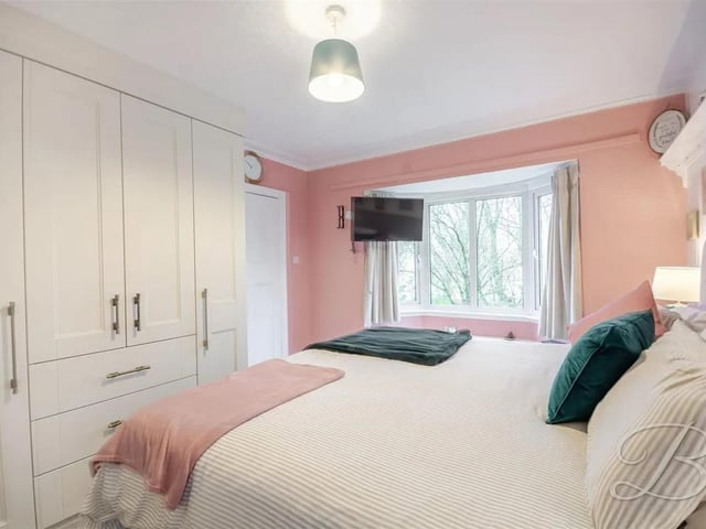 Equipped with ample storage cupboards, central heating radiator and carpeted flooring, this elegant room is crowned enjoys an abundance of natural light
