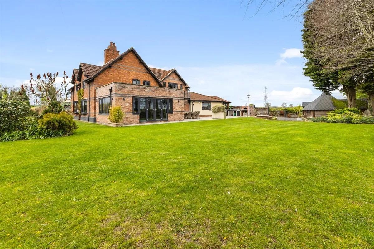 There is a lawned garden to the front, which then extends to the side and is the main garden to the property.