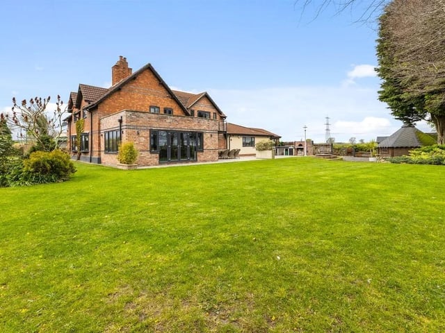 There is a lawned garden to the front, which then extends to the side and is the main garden to the property.