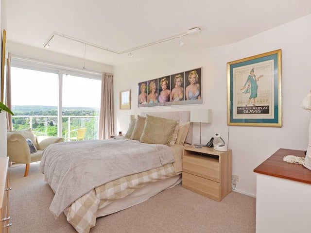 The accommodation on the first floor is completed with an "excellent master bedroom", generous in size, with a sloping, high ceiling, and patio doors, which open onto another balcony with views.
