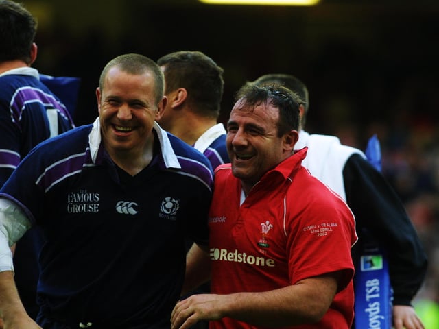 The grins on the faces of Mattie Stewart and George Graham tell their own story as the props celebrate a rare Scotland victory in Cardiff. Graham, wearing a Wales jersey, had come on as a replacement for Stewart.