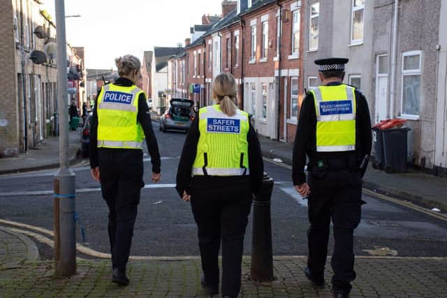 Police and community officers on patrol.
