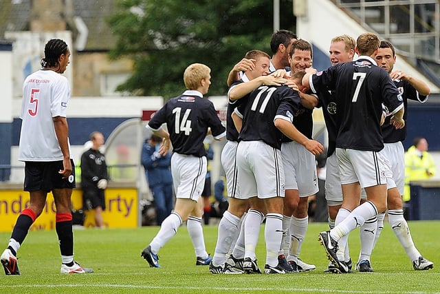 Joe Hamill is mobbed after scoring the only goal in League One win in August 2011.