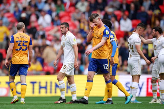 Oli Hawkins is upset as he leaves for an early bath at Wembley in May.