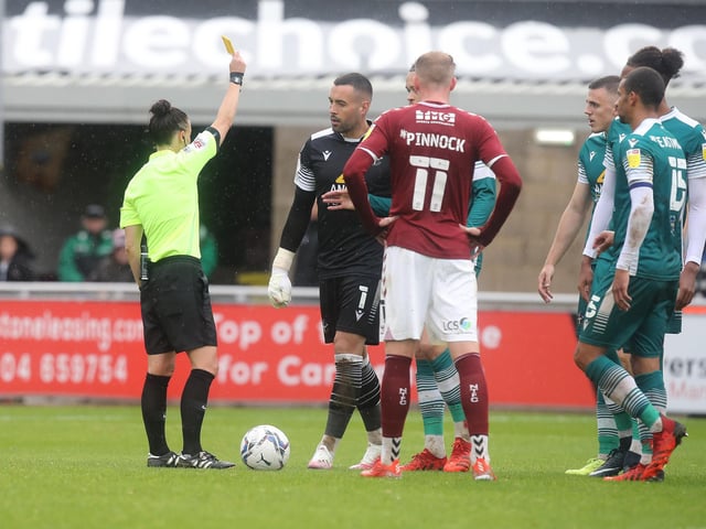 Dean Bouzanis is shown a yellow card by referee Rebecca Welch. It was one of 62 bookings and three reds for the Londoners.