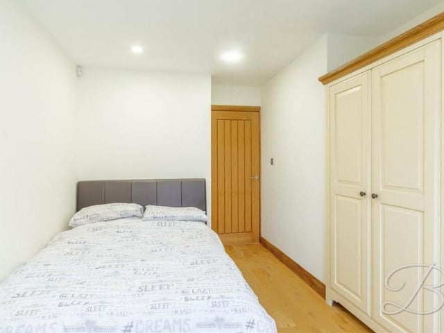 Bedroom number three is simple but stylish, with handy wardrobe space.