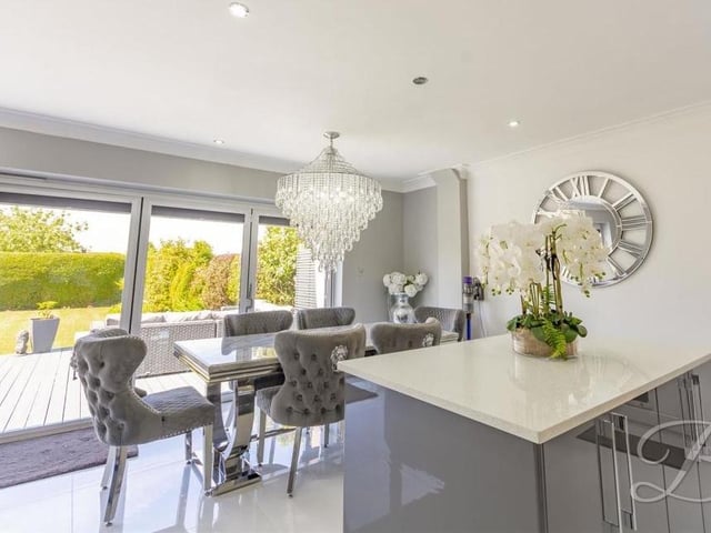 The open-plan living space extends to the classy kitchen/diner, which includes room for a dining table and chairs in front of the bi-fold doors to the garden.