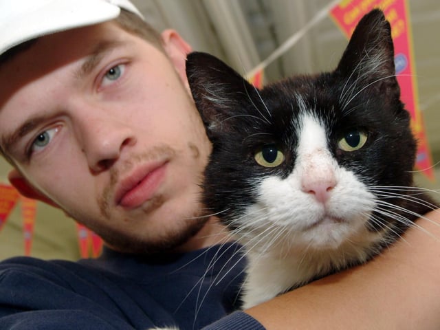 Animal Care Assistant Alex Charles is pictured with Luca a 2 year old cat who was found wondering in Mansfield Woodhouse, limping and covered with fleas. 2008.
