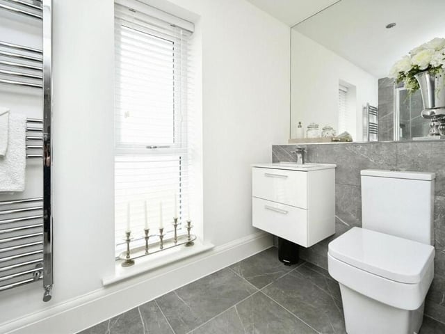 The excellent en suite shower room to the main bedroom on the second floor includes a vanity wash hand basin, WC, heated towel-rail and tiled flooring.
